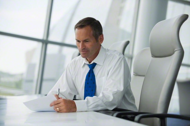 Caucasian businessman working in conference room